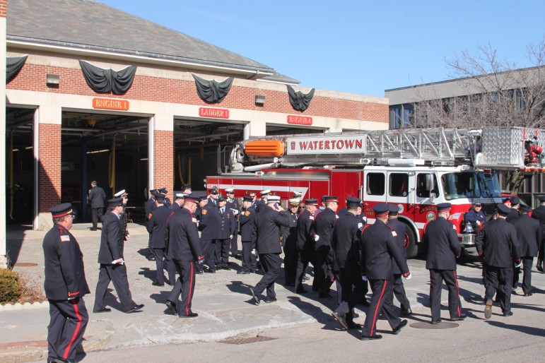 Firefighters from around the state and across the U.S. came to Tuesday's wake. Here they gather outside Watertown Fire Headquarters. Photo by Charlie Breitrose.