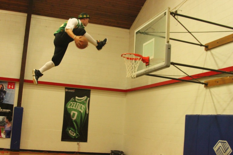 Lucky, the Boston Celtics' mascot, goes in for a dunk at the Watertown Boy's & Girl's Club.