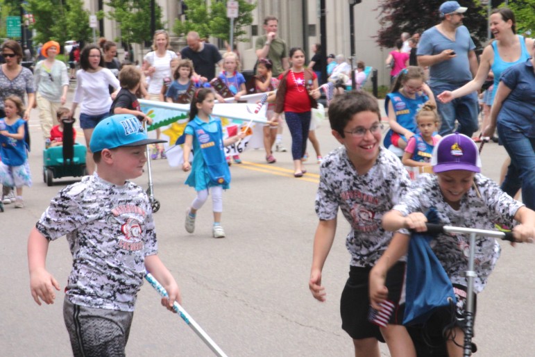 Boys from Watertown Youth Lacrosse have some fun during the Watertown Memorial Day Parade.