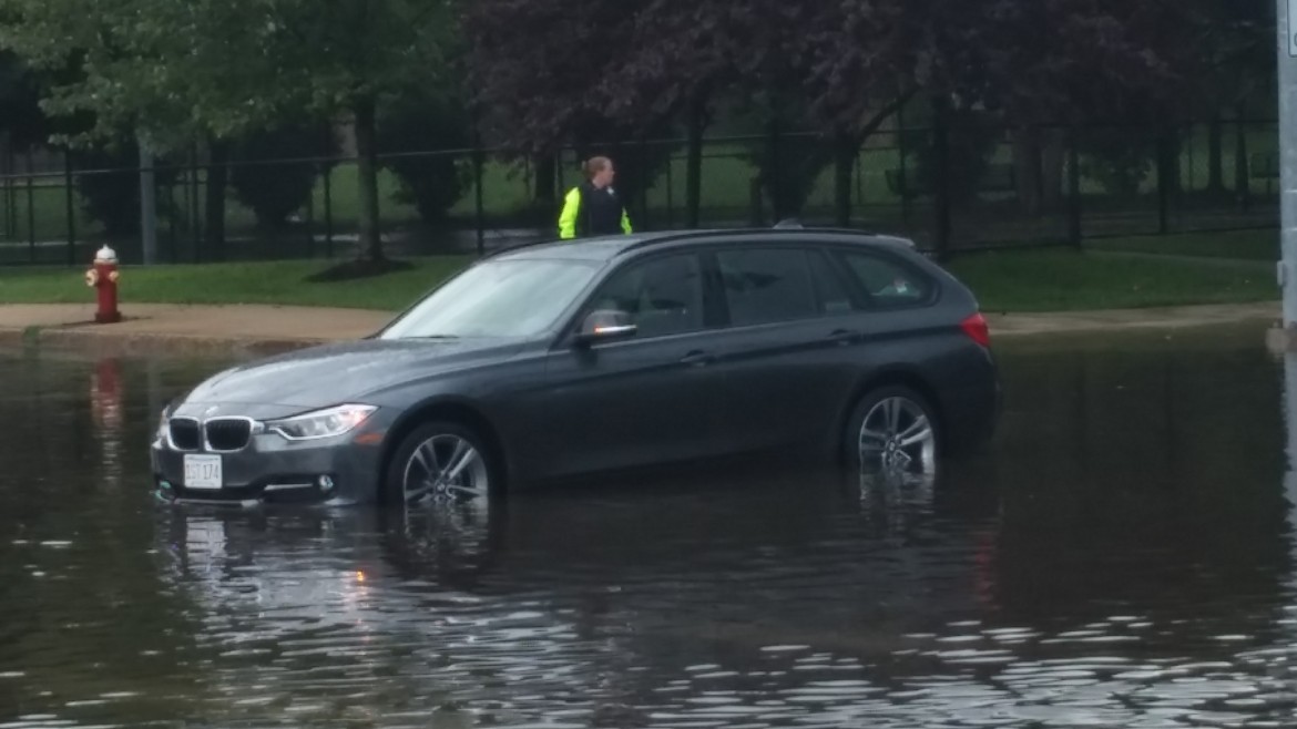 A car stuck in the flood water at Arlington and Mt. Auburn streets. 