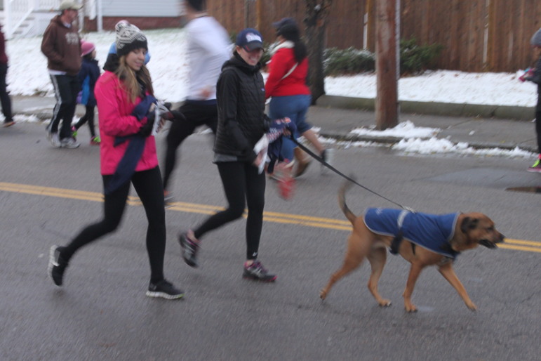 Several dogs joined in the race at the Turkey Trot.