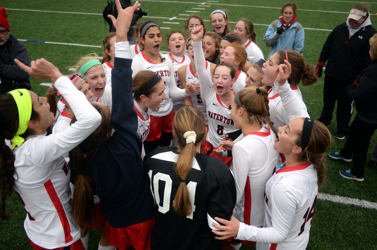 Watertown field hockey team celebrate after defeating Auburn 5-0 in the state final at WPI Sunday.