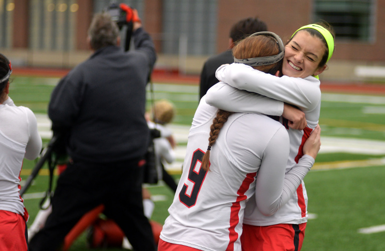 Watertown's Emily Loprete (left) and Allie Doggett celebrate after defeating Auburn High School 5-0 at WPI Sunday afternoon. 