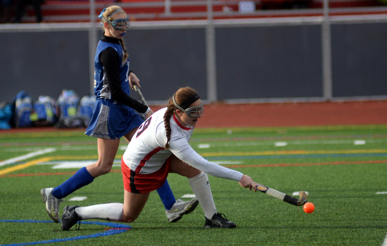 Watertown co-captain Emily Loprete fires a shot Sunday's state final against Auburn. The senior scored a hat trick in her final game as a Raider.