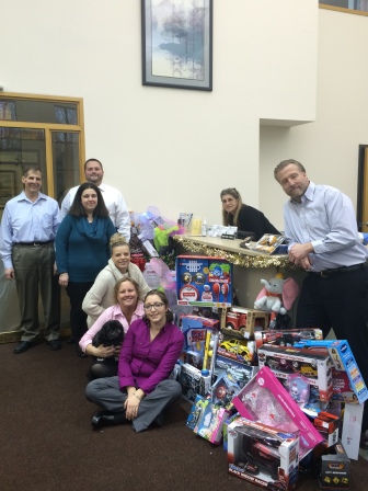 Employees of H & K Insurance collected a record number of items for the Toys for Tots drive.