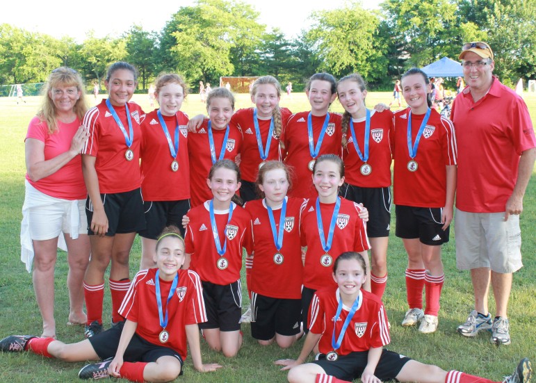 The Watertown Power players wearing their medals from the Portsmouth Invitational Youth Soccer tournament.
