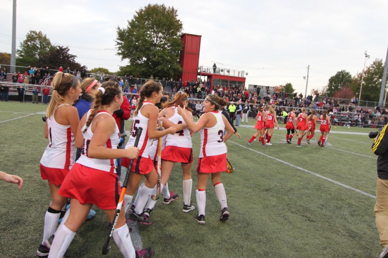 The record setting Watertown Raiders field hockey team celebrates after its historic win.