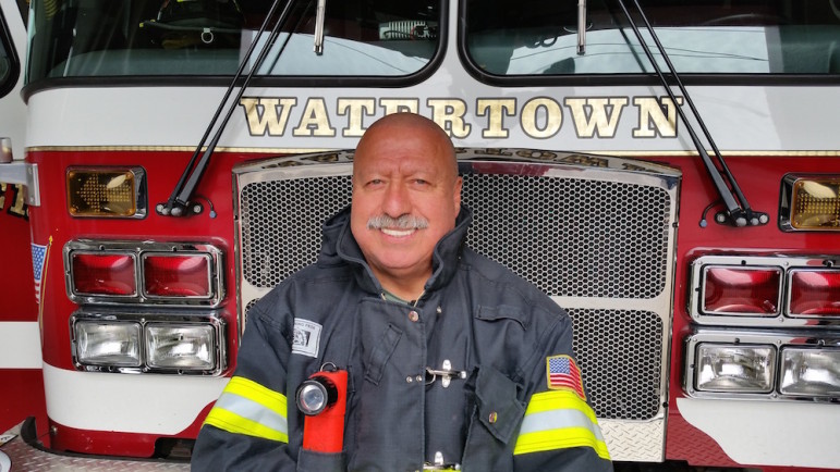 Watertown Firefighter Willie Gaitan shows off his newly shaved head. He cut it after three years to celebrate the Fire contact signing and help a cancer patient.