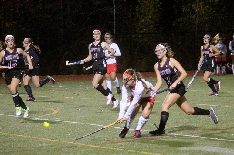 Watertown's Kourtney Kennedy fires a shot at the Weston goal in the North Section semifinal.