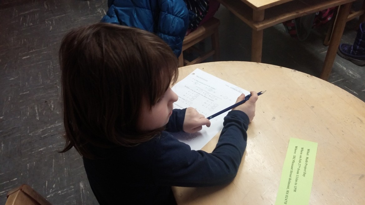 A kindergartner works on math problems in a class at the Russian School of Math.