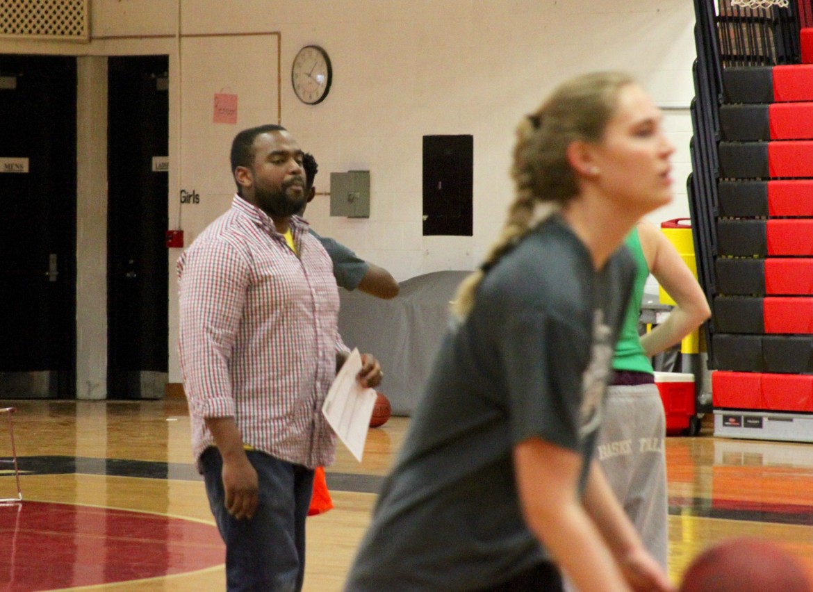 Watertown girls basketball head coach Patrick Ferdinand watches his team practice before the state final against Longmeadow.