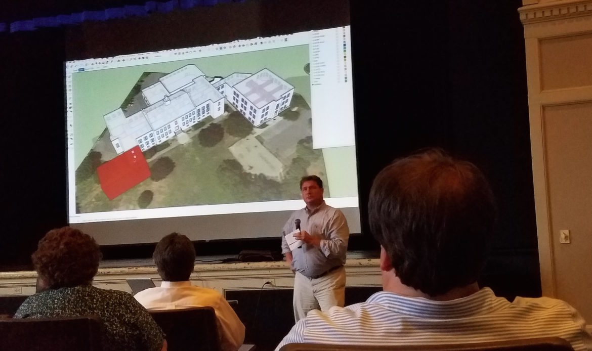 SMMA's Michael van Hamel discusses a slide showing a section of Watertown High School that could be reconfigured to be used better during the School Master Plan Community Forum. 