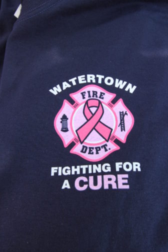 A closeup of the front logo of this year's Watertown Fire Department "Fighting for a cure T-shirt.