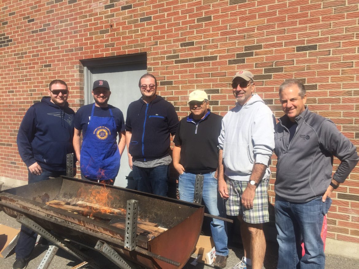 Rotary Club of Watertown members firing up the grill for the Senior Citizen Cookout.