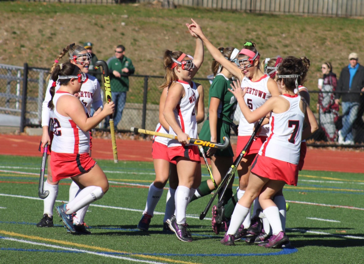 Watertown co-captain Kourney Kennedy, left, gets a high five from sophomore Gabby Venezia after scoring the first goal in the State Final win against Oakmont.