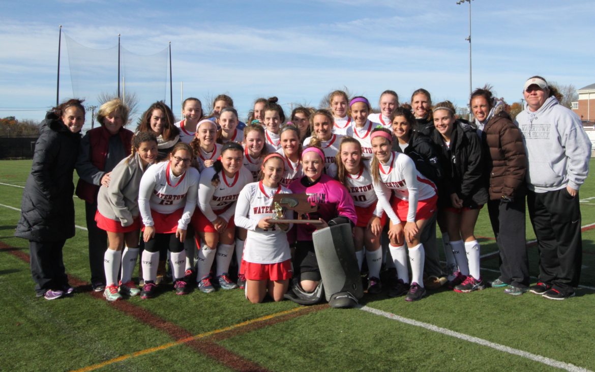 Watertown's field hockey team celebrates winning the 2016 North Section Div. 2 title, the team's ninth straight.